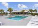 Relaxing pool area with lounge chairs and cabana at 11771 Richmond Trl, Parrish, FL 34219