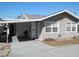 Quaint cottage style home with covered carport and mature landscaping at 12 Desoto E St, Bradenton, FL 34208