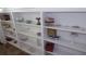 White shelving unit filled with decorative items at 12 Desoto E St, Bradenton, FL 34208