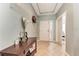 Bright entryway with tile floors and a wooden console table at 12219 23Rd E St, Parrish, FL 34219