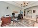 Home office with built-in shelving and a view of the kitchen at 12219 23Rd E St, Parrish, FL 34219