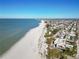 Aerial view of beachfront homes and ocean at 128 51St St # A, Holmes Beach, FL 34217