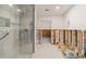 Partially renovated bathroom with a new shower and exposed walls at 128 51St St # A, Holmes Beach, FL 34217