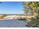 White sand beach with vegetation and partial ocean view at 128 51St St # A, Holmes Beach, FL 34217