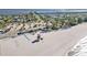 Aerial view of beach with lifeguard stand and nearby buildings at 128 51St St # A, Holmes Beach, FL 34217