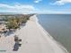 Aerial view of beach with lifeguard stand, showing beachfront property at 128 51St St # A, Holmes Beach, FL 34217