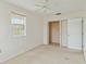 Bedroom with ceiling fan, closet, and carpeted floor at 128 51St St # A, Holmes Beach, FL 34217