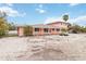 Pink house with covered porch and mature palm trees at 128 51St St # A, Holmes Beach, FL 34217