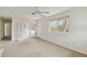 Bright living room with carpet, laundry area, and access to outside at 128 51St St # A, Holmes Beach, FL 34217