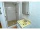 Simple basement bathroom with shower and small vanity at 1330 Cocoanut Ave, Sarasota, FL 34236