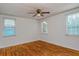 Spacious bedroom with hardwood floors and two windows at 1330 Cocoanut Ave, Sarasota, FL 34236