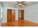 Bedroom with hardwood floors, ceiling fan and closet at 1330 Cocoanut Ave, Sarasota, FL 34236