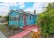 Charming light blue house with red door and walkway at 1330 Cocoanut Ave, Sarasota, FL 34236