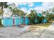 Exterior view showing teal home and detached garage at 1330 Cocoanut Ave, Sarasota, FL 34236