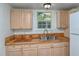 Simple kitchen with light wood cabinets and sink at 1330 Cocoanut Ave, Sarasota, FL 34236