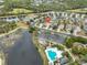 Aerial view of house and community, including pool and pond at 1479 Blue Horizon Cir, Bradenton, FL 34208