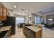 Kitchen with granite countertops, dark wood cabinets, and stainless steel appliances at 1479 Blue Horizon Cir, Bradenton, FL 34208