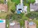 Aerial view showing home, pool, and surrounding landscape at 1604 21St W Ave, Palmetto, FL 34221