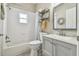 Clean bathroom with shower/tub combo and gray vanity at 1604 21St W Ave, Palmetto, FL 34221