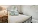 Bright bedroom with a queen-size bed and light decor at 1604 21St W Ave, Palmetto, FL 34221