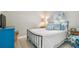 Cozy bedroom with a comfortable bed and beach-themed decor at 1604 21St W Ave, Palmetto, FL 34221