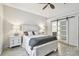 Bright bedroom with a white bed frame and barn door at 1604 21St W Ave, Palmetto, FL 34221