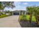 Single-Gathering home with a grey exterior and a lush lawn at 1604 21St W Ave, Palmetto, FL 34221