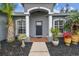 Welcoming entryway with columns and potted plants at 1604 21St W Ave, Palmetto, FL 34221