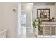 Hallway features a charming console table and leads to a bathroom at 1604 21St W Ave, Palmetto, FL 34221