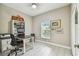 Bright home office features built-in shelving and window at 1604 21St W Ave, Palmetto, FL 34221