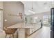 Kitchen island with seating area and stylish light fixture at 1604 21St W Ave, Palmetto, FL 34221