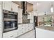 Modern kitchen with stainless steel appliances and white cabinetry at 1604 21St W Ave, Palmetto, FL 34221