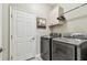 Laundry room with washer, dryer, and built-in cabinets at 1604 21St W Ave, Palmetto, FL 34221