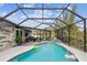 Inviting pool and screened enclosure with deck at 1604 21St W Ave, Palmetto, FL 34221