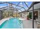 Screened pool and patio area with spacious deck at 1604 21St W Ave, Palmetto, FL 34221