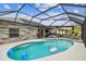 Relaxing pool area with covered patio and deck at 1604 21St W Ave, Palmetto, FL 34221