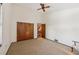 Well-lit bedroom with double closets and access to upper loft at 1702 Spoonbill Dr, Nokomis, FL 34275