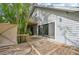 Wooden deck alongside house with access to backyard at 1702 Spoonbill Dr, Nokomis, FL 34275