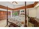 Main bedroom with king bed, ample closet space, and private access to deck at 1702 Spoonbill Dr, Nokomis, FL 34275