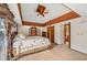 Main bedroom with a four-poster bed and en-suite bathroom access at 1702 Spoonbill Dr, Nokomis, FL 34275