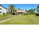 Community building with a grassy area at 1783 Lake Pl # 1783B, Venice, FL 34293