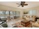 Spacious living room with canal view and comfortable seating at 1783 Lake Pl # 1783B, Venice, FL 34293