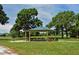 Community park gazebo with picnic tables, grill, and ample shade at 1783 Lake Pl # 1783B, Venice, FL 34293