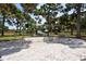 Playground with swings in a sandy area at 1783 Lake Pl # 1783B, Venice, FL 34293