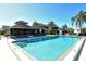 Inviting community pool with a pool house at 1783 Lake Pl # 1783B, Venice, FL 34293