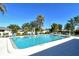 Community swimming pool with lounge chairs at 1783 Lake Pl # 1783B, Venice, FL 34293