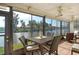 Enjoy water views from this screened porch with patio seating at 1783 Lake Pl # 1783B, Venice, FL 34293