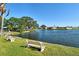 Peaceful waterfront view with benches at 1783 Lake Pl # 1783B, Venice, FL 34293