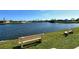 Peaceful waterfront view with benches overlooking a canal at 1783 Lake Pl # 1783B, Venice, FL 34293