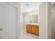 Bathroom with a tiled shower and good-sized vanity at 1817 New London St, North Port, FL 34288